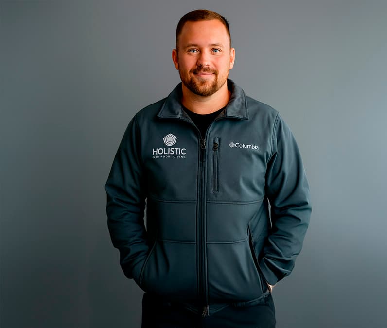 Tony Carter in Holistic Patio uniform representing expert project management for luxury outdoor design in Fort Worth, TX