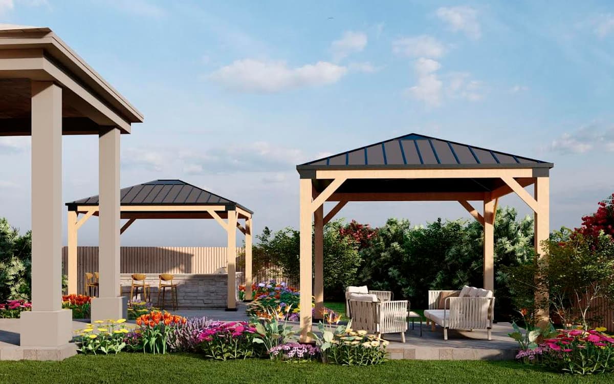 Backyard with two wooden pergolas, outdoor seating, and colorful outdoor living designs in Fort Worth, TX
