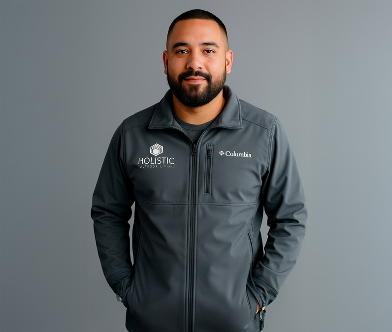 John Rivera in Holistic Patio jacket representing on-site supervision and quality luxury outdoor design in Fort Worth, TX