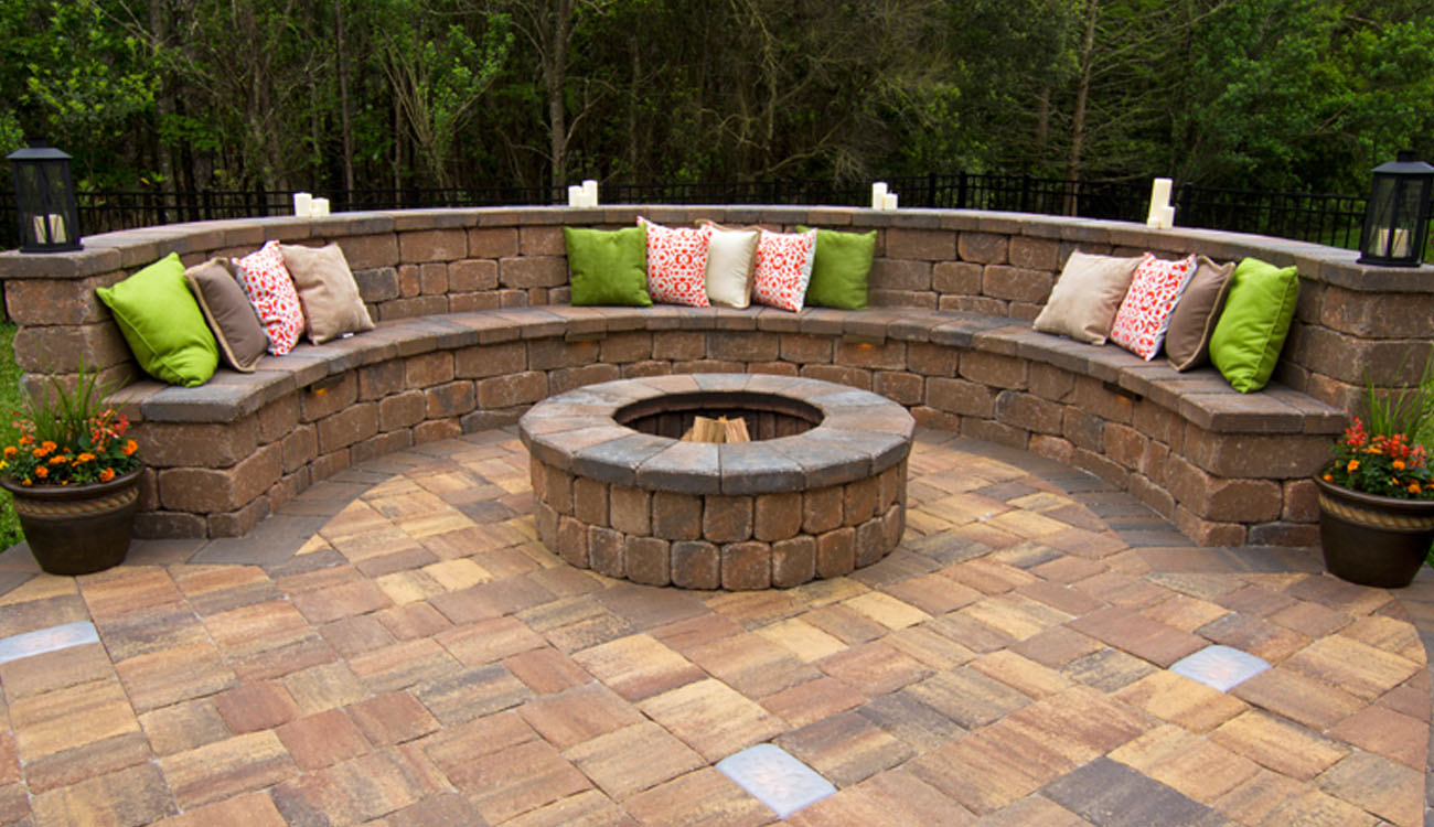 Holistic Patio Hardscaping Services in Fort Worth, TX - Holistic Patio Retaining Wall with Seating Ideas c2 curved retaining wall with built-in seating and circular fire pit surrounded by pavers, featuring Retaining Wall with Seating Ideas for modern patios