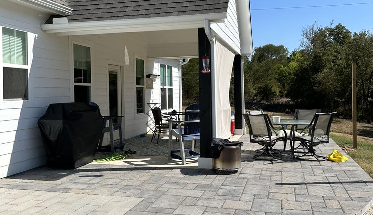 Holistic Patio Hardscaping Services in Fort Worth, TX - Holistic Patio Small Modern Patio Ideas for a Stylish Retreat c2 backyard with gray paver flooring, dining area, and covered seating, highlighting Modern Patio Ideas for outdoor living in Texas