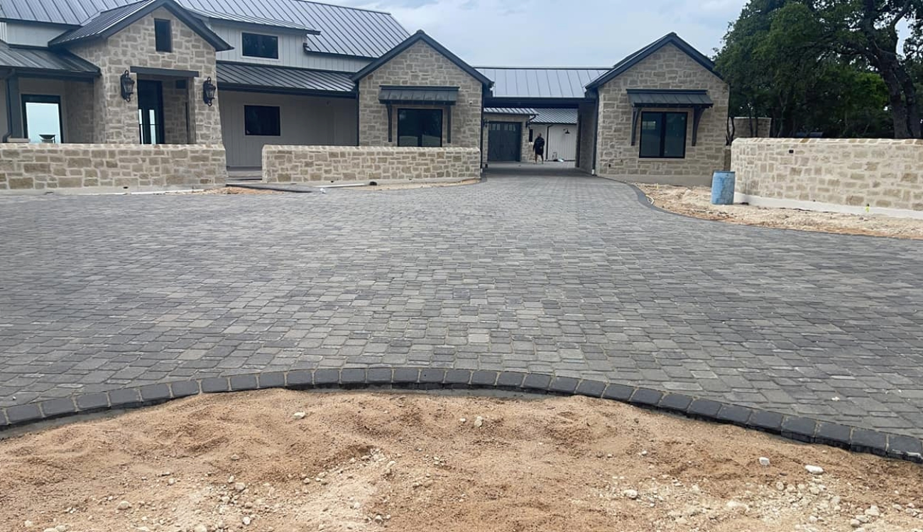 front yard patio designs with pavers and a clean walkway entrance